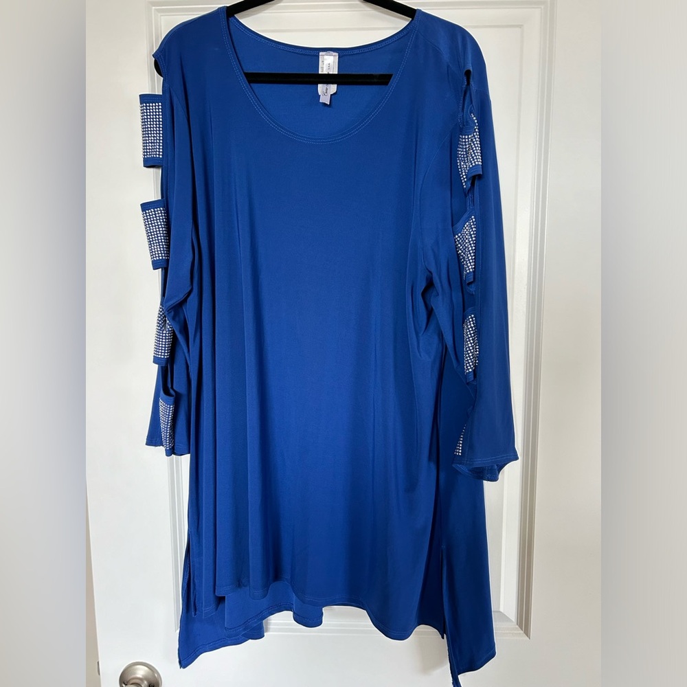 Fancy sequined top with sleeve cutouts.